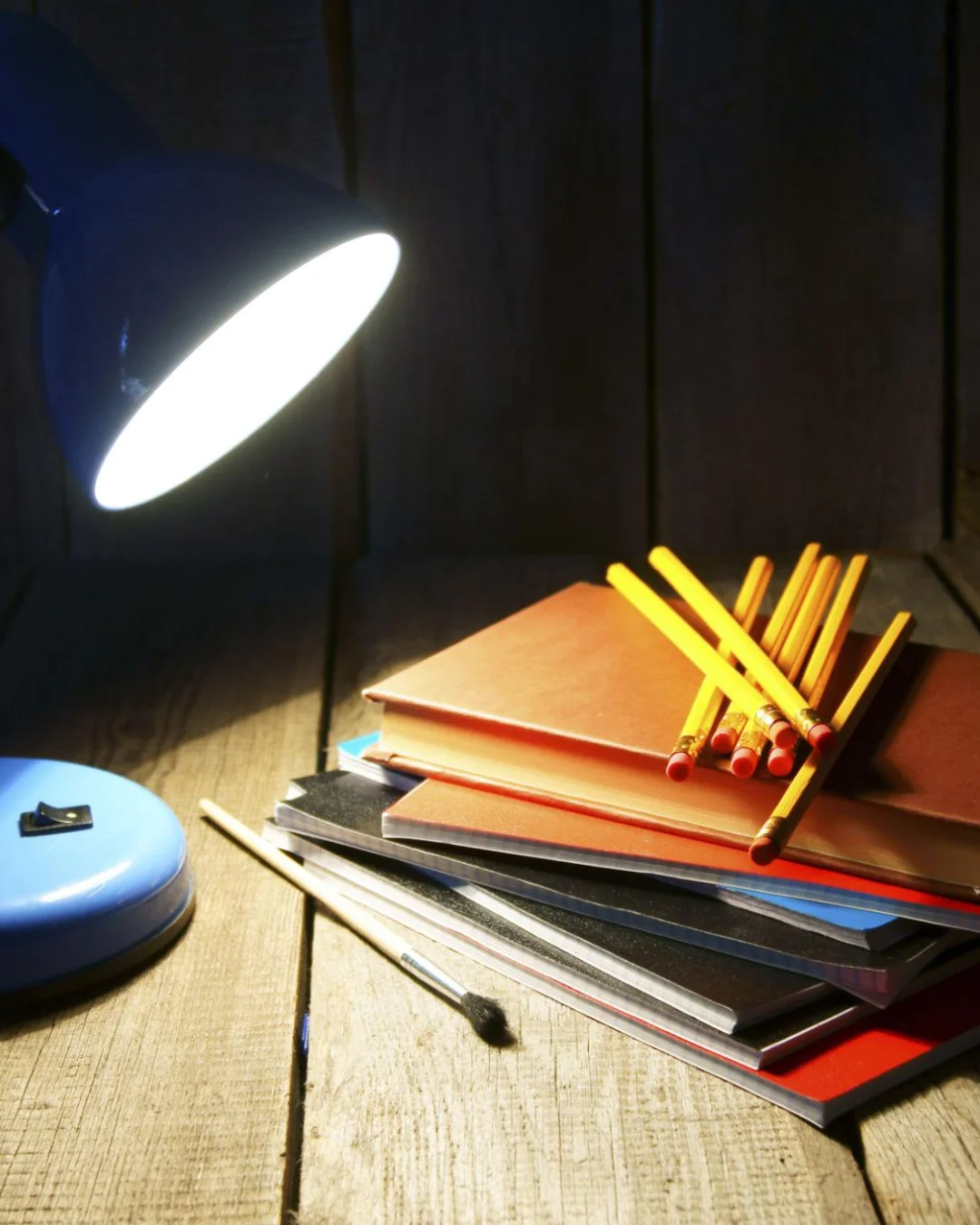 Study desk with books and pencils